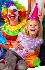 Birthday child clown playing with children and bunny fingers prank. Kid holiday cakes celebratory and balloons the happiest birthday. Mom arranged party for her daughter.