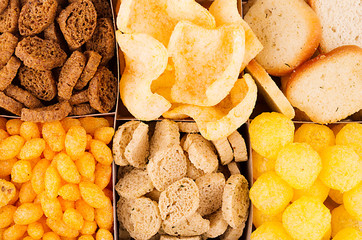 Different mexican beer snacks as background, closeup, top view. Fast food backdrop.