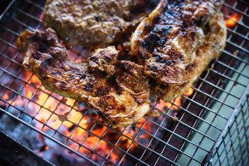 Meat on the grill with flame. Outdoor bbq