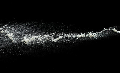 flour on a black background