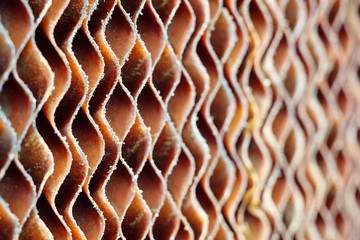 Close up of old dirty brown cellulose paper pad or evaporative cooling pad texture background. ...