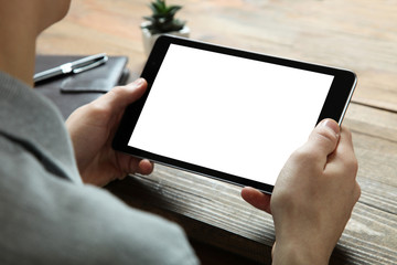 A modern tablet in the hands of a guy