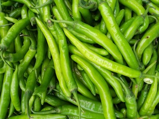 culinary background of fresh hot green chillies