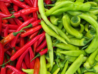culinary background of fresh hot green red chillies