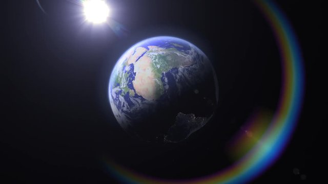 Blue Marble Rainbow, Americas (25fps). Flying towards North America on Earth as it rotates in outer space highlighted with a beautiful rainbow colored flare.