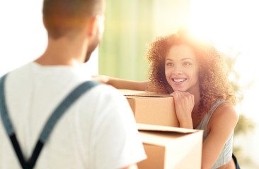 Portrait of a young wife when moving to a new house