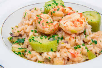 dish with risotto with prawns and zucchini