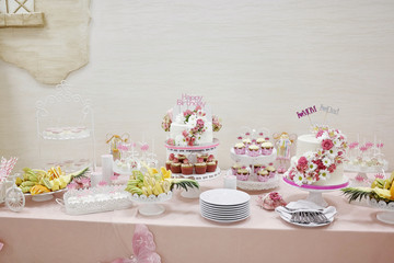 Birthday party candy bar. Weeding desserts. Exquisite food. Cupcakes, muffins, lollipops, macarons, waffles, princess pink theme party. Fun and joy. Children party time decor