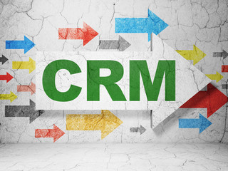 Business concept:  arrow with CRM on grunge textured concrete wall background, 3D rendering