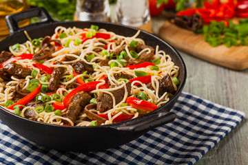 Chinese pasta with beef. Prepared in wok.
