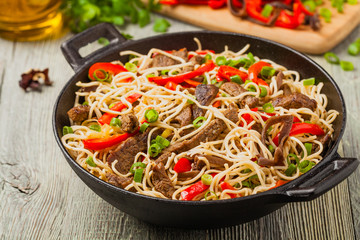 Chinese pasta with beef. Prepared in wok.