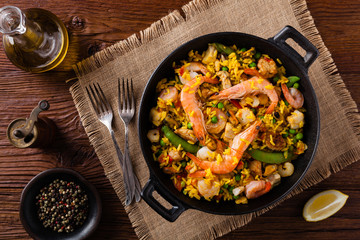 Traditional Spanish paella with seafood and chicken.