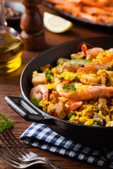 Traditional Spanish paella with seafood and chicken.