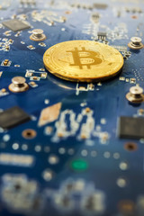 Bitcoin concept - mainboard with bitcoin processor and microchips
