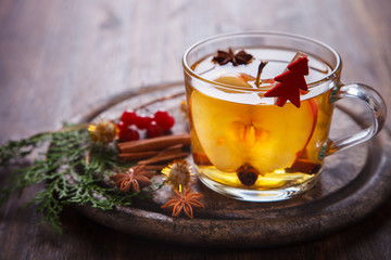 Apple Cider Drink,Juice,Cider with Spices ,Cinnamon sticks and fresh Apples.Hot drink for Autumn and Winter Christmas evenings.selective focus.