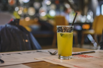 soda drink with lime and mint with a straw.
