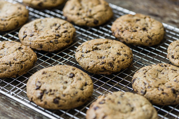 Freshly Baked Chocolate Cookies on Cooling Rack. Sweet Biscuits. Homemade pastry.