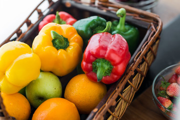 Chilli peppers and vegetables in basket, healthy food concept.