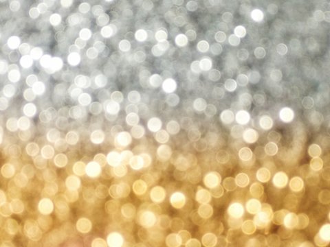 Silver and gold abstract bokeh sparkle twotone lights. defocused background