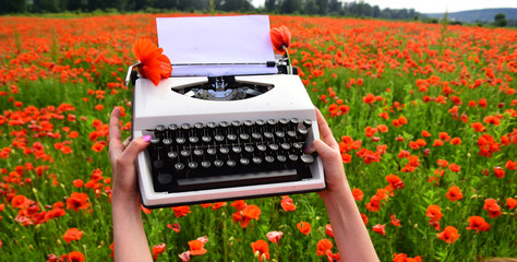 Vintage typewriter in hand, education, business, grammar.