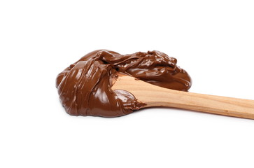 Cream chocolate spreading and wooden spoon isolated on white background