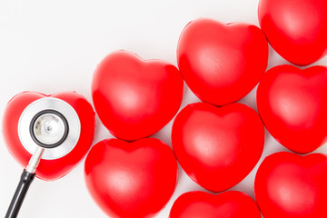 Red heart and a stethoscope. Isolated on white background. Studio lighting. Concept for healthy and medical