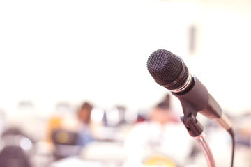 Close up microphone in conference on seminar room event background 