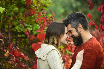 Fototapeta premium Couple with smiling faces cuddle each other with tenderness.