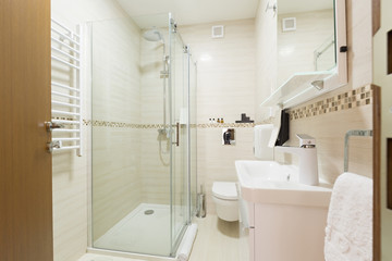 Fototapeta na wymiar Interior of a hotel bathroom with shower cabin