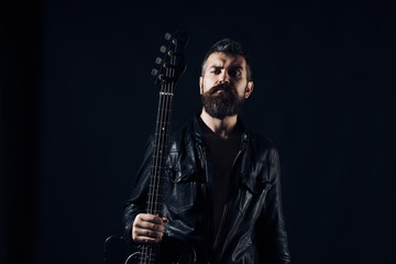 Young bearded man with electric guitar