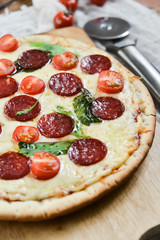 Tasty Pizza With Tomato Sauce, Pepperoni Sausage, And Mushrooms On Wooden Background Natural Rustic, A Pizza Cutter And Ingridienty.