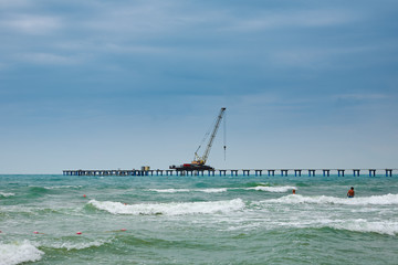 Waves next to the pier under construction