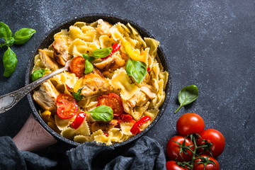 Pasta with chicken and vegetables top view.