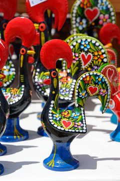 Painted rooster ornaments which are the unofficial symbol of Portugal, Algarve, Portugal.