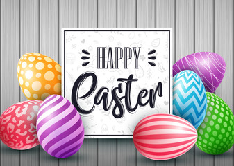 Easter card with colored decorated eggs on wood background