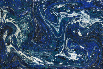 Creative abstract art background in blue and white colors. Handmade painted background. Acrylic painting on paper. Liquid paint.