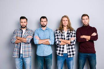 Obraz premium Harsh concentrated angry self-assured brutal macho strength success concept. Portrait of four calm peace man wearing checkered shirt turtleneck standing with crossed arms isolated on gray background