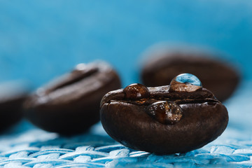 shiny fresh roasted coffee macro beans on woven background
