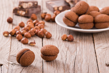 Hazelnut shortbread sandwiches filled with chocolate cream.