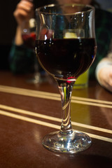 Pouring red wine into the glass