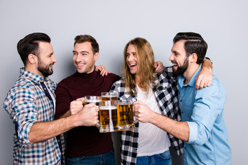 Tourism trip travel lager bock draught ethnicity diversity restaurant. Four cheerful excited friends, checkered casual shirt clinking pints of beer, hugging isolated on gray background
