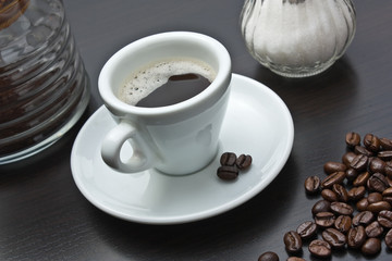 pile of coffee beans and a cup