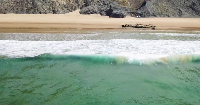 Aerial Drone View Of Blue Ocean Waves And Beautiful Sandy Beach in Portugal