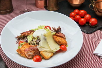 Delicious salad with chicken, tomatoes, egg and vegetables