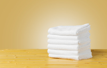 Fototapeta na wymiar Stack of folded white spa towels