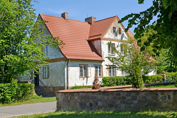 House of pre-war construction with a tile roof. Settlement Amber, Kaliningrad region