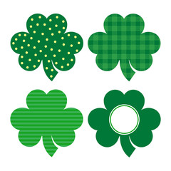 Set of four clovers with different designs, isolated. Good luck symbol.