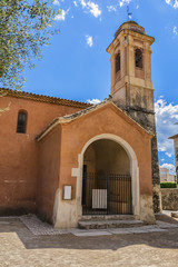 Fototapeta premium Eglise des Penitents Blancs (XVII century) in Saint Paul de Vence with Dome covered with polychrome tiles. Chapel was seat and praying area of confraternity of Penitents Blancs. Cote d'Azur, France.