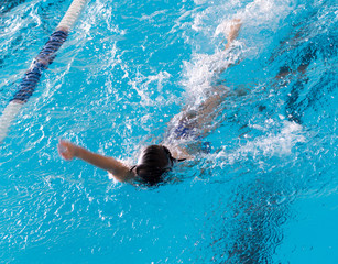 boy on a swim in a sports pool