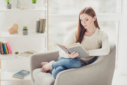 Fun free-time highschool people person hipster interior warm casual emotion expressing intelligence alone domestic knowledge concept. Beautiful cute tender calm girl reading novel in a living room